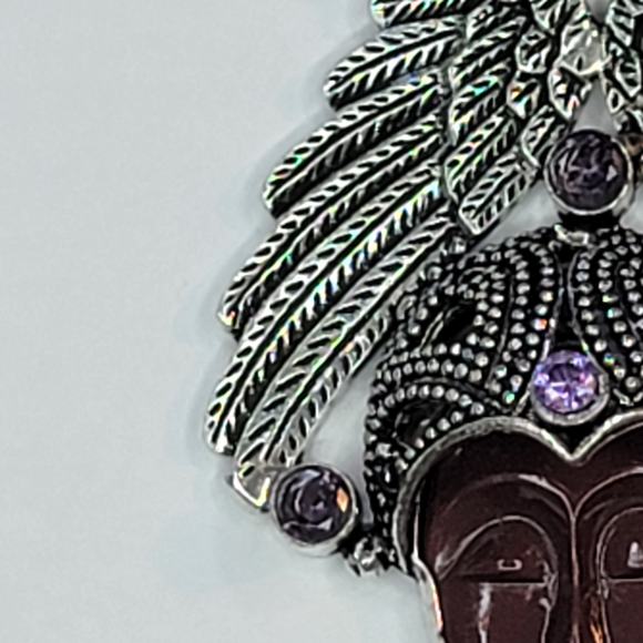 Sterling Silver Pendant with Brown Carved Face, Blue Topaz, and Feather Motif - Picture 8 of 13